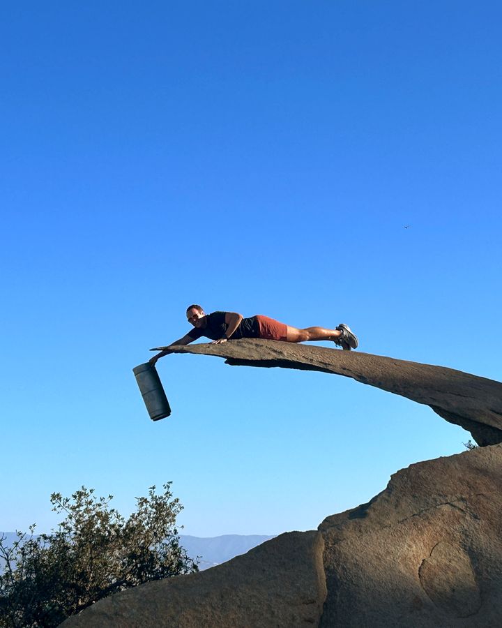 A Perpetual founder planking on Potato Chip Rock with an AleSmith beer keg in hand, on the way to a Carmel Valley keg delivery